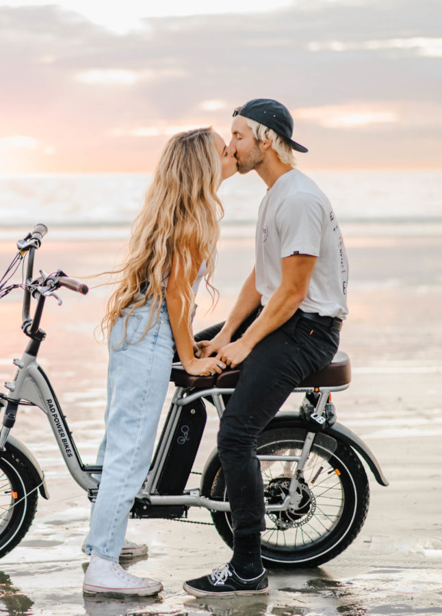 couple kissing beach sunset engagement photos