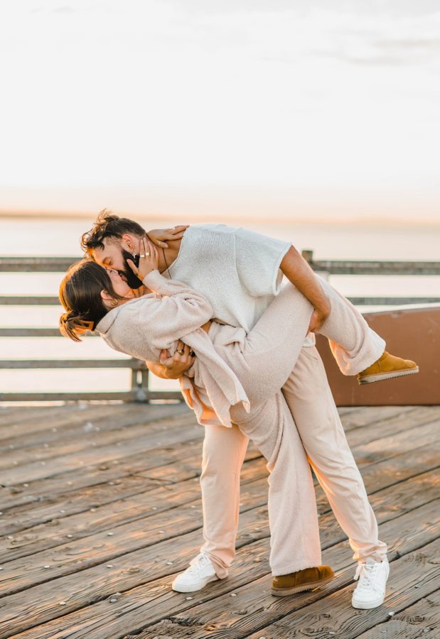 couple kissing california sunrise