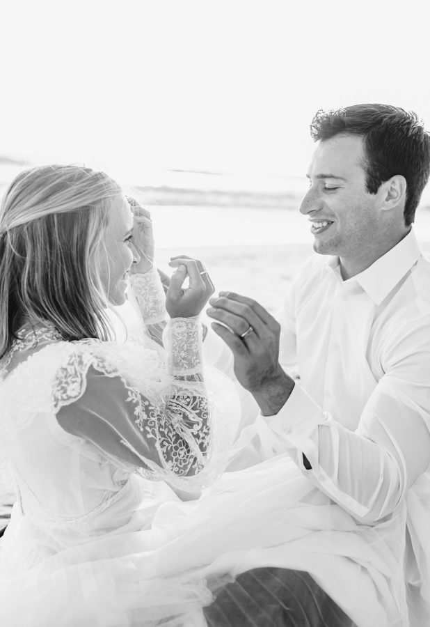 black and white wedding couple laughing