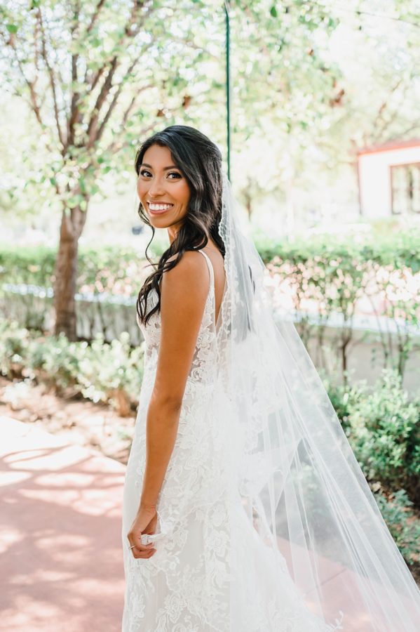 bride smiling wedding dress veil