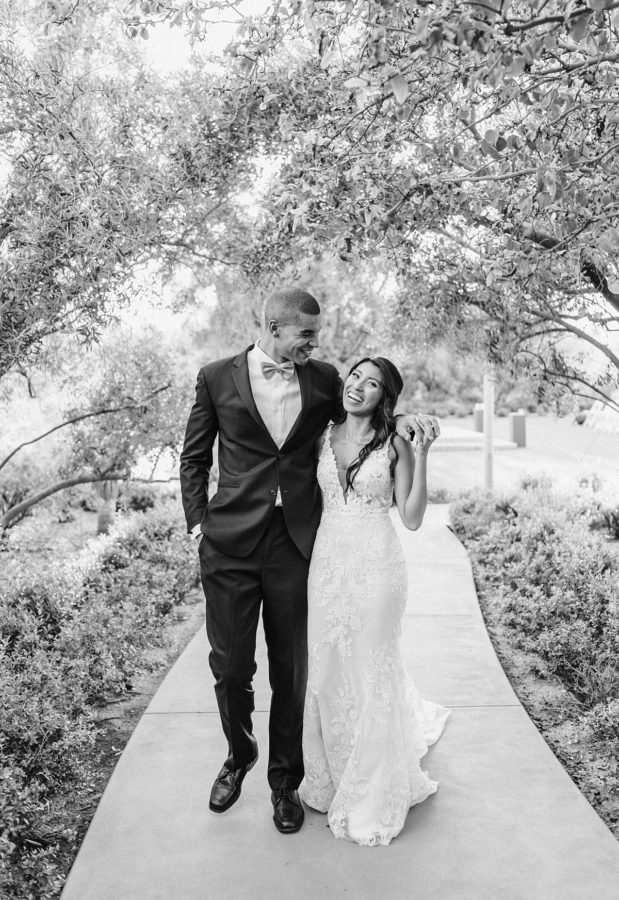 black and white bride and groom smiling