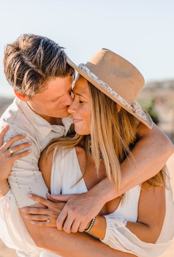 crystal cove state park engagement couple hugging neutrals