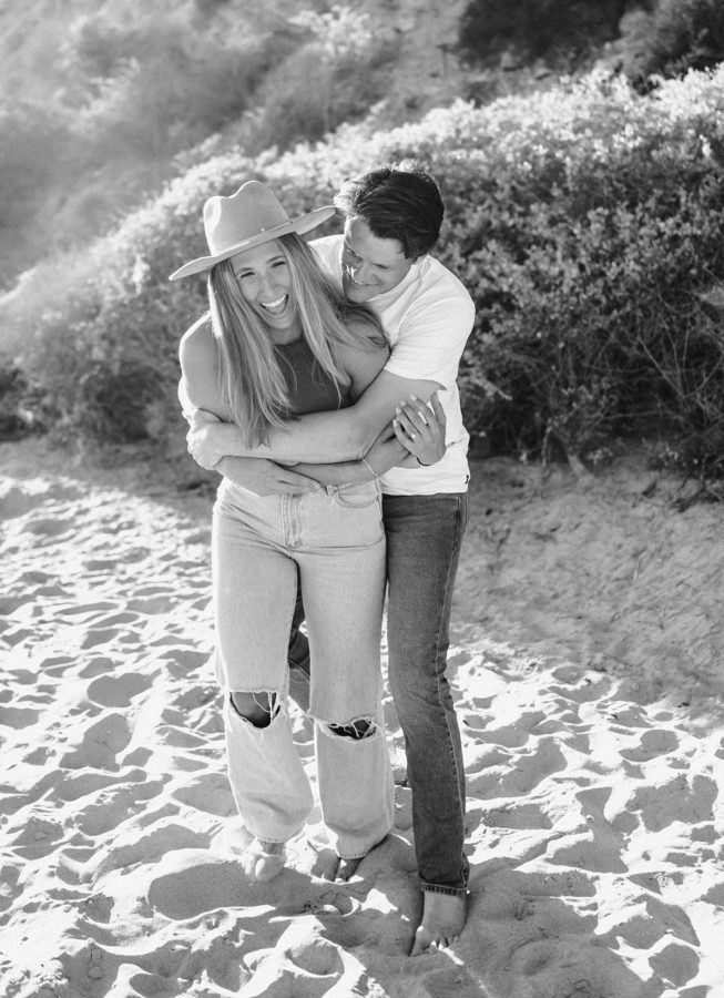 black and white crystal cove state park engagement couple hugging