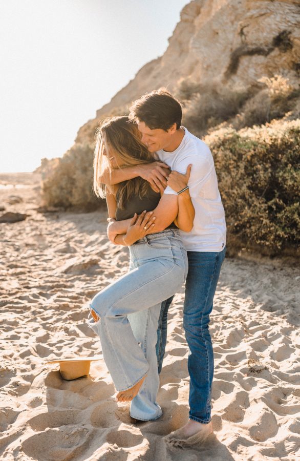 crystal cove state park engagement couple hugging
