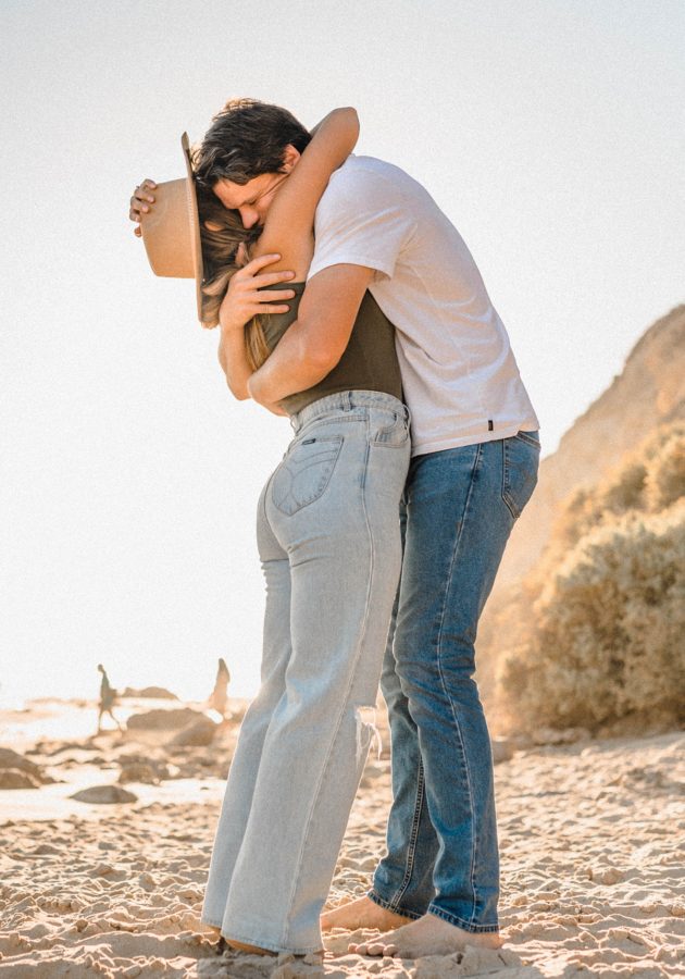 crystal cove state park engagement couple hugging