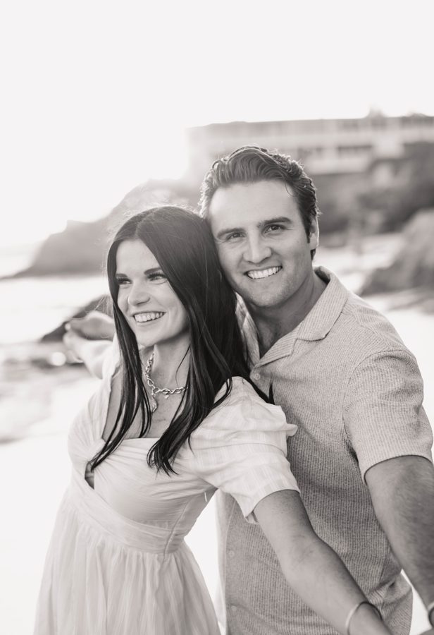 black and white couple pose smiling