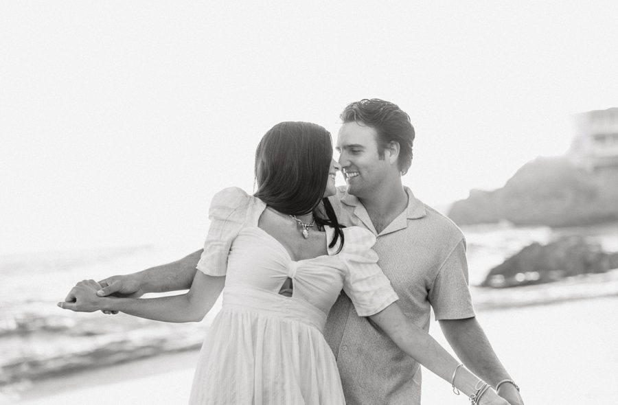 black and white couple dancing beach