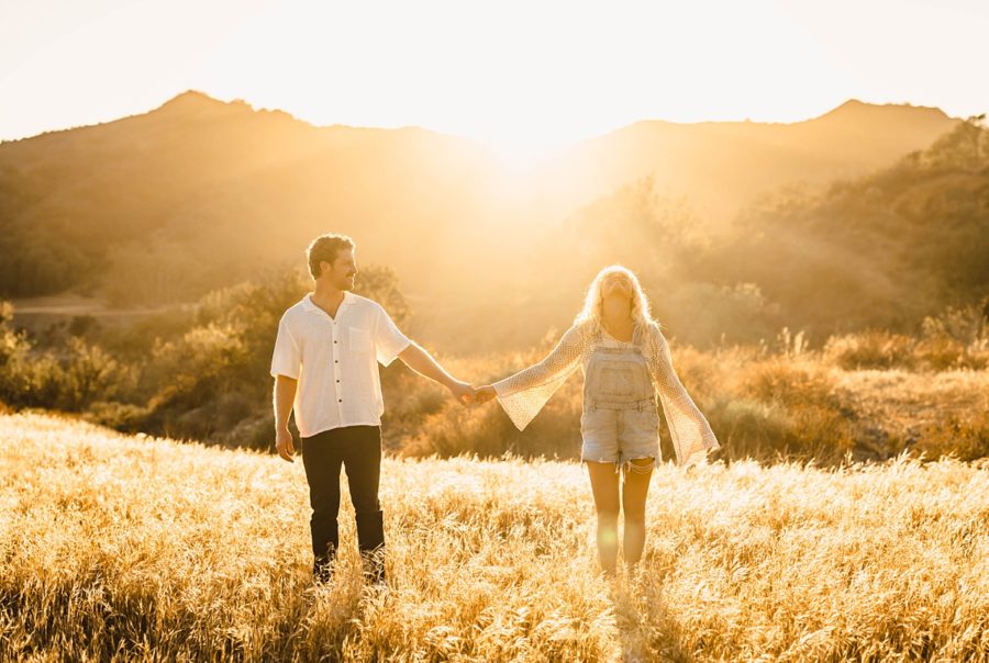 couple posing golden hour mountains