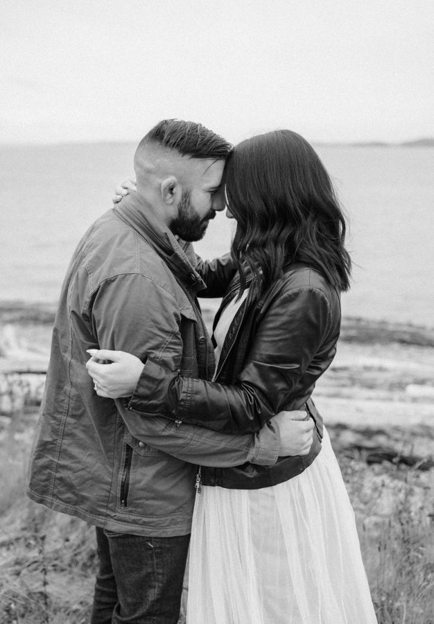 black and white fall engagement discovery park couple hugging