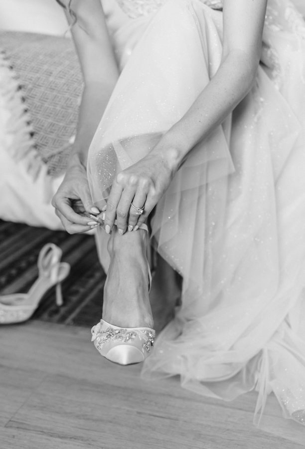 black and white bride getting ready wedding dress details