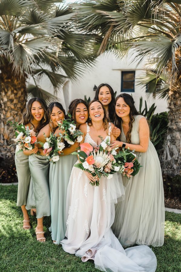 ole hanson beach club wedding bride bridesmaids smiling bouquets