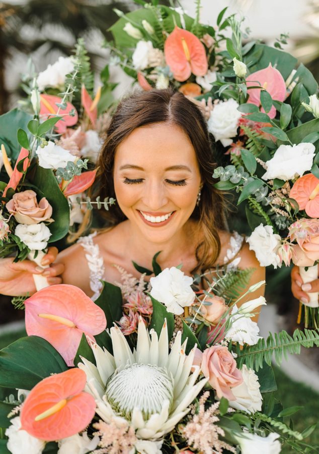bride smiling king protea bouquets