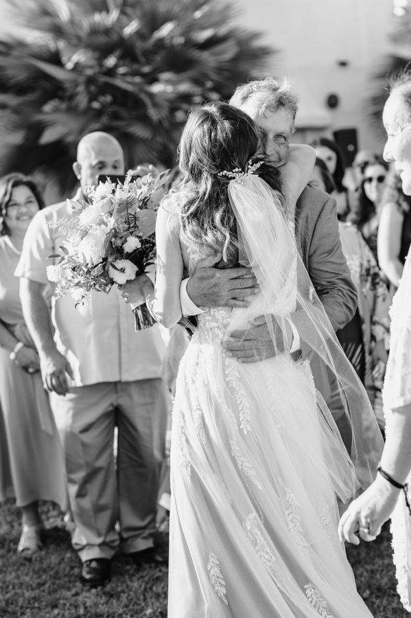 black and white bride hugging