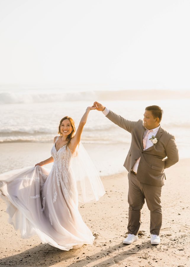 bride and groom dancing beach wedding dress