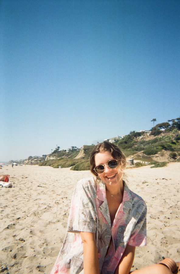 girl smiling beach sunglasses