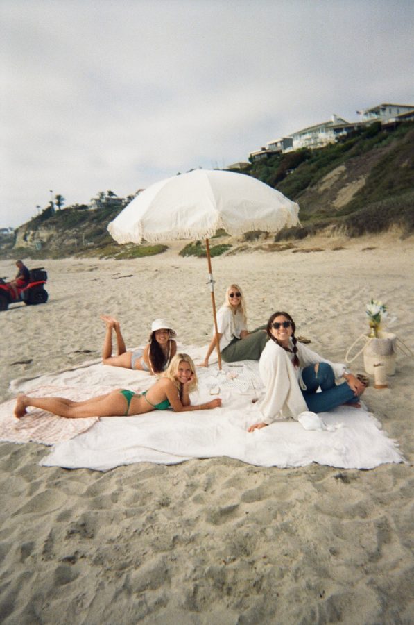 girls on beach boho umbrella