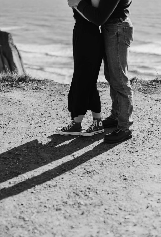 fall san clemente date night black and white couples pose converse shoes