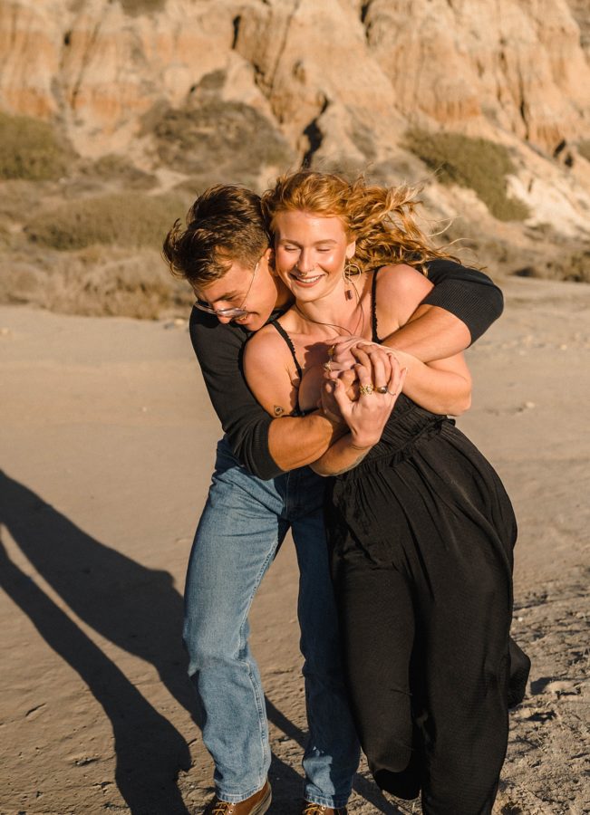 cliffside beach california portrait session hugging pose 