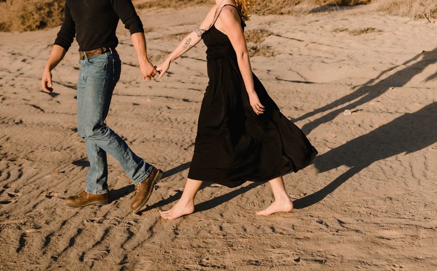 couple walking on california beach photos
