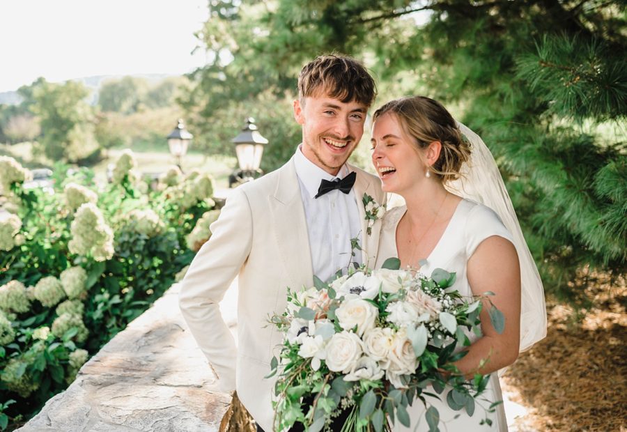 intimate bluemont vineyard wedding bride and groom smiling hugging