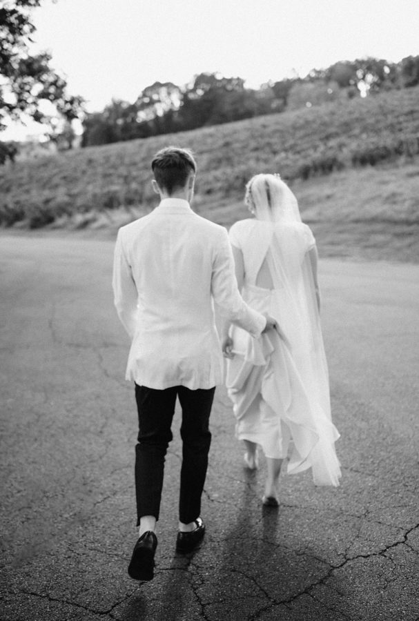 intimate bluemont vineyard wedding black and white bride and groom walking
