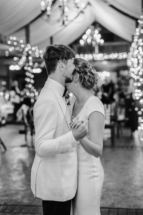 intimate bluemont vineyard wedding black and white bride and groom smiling