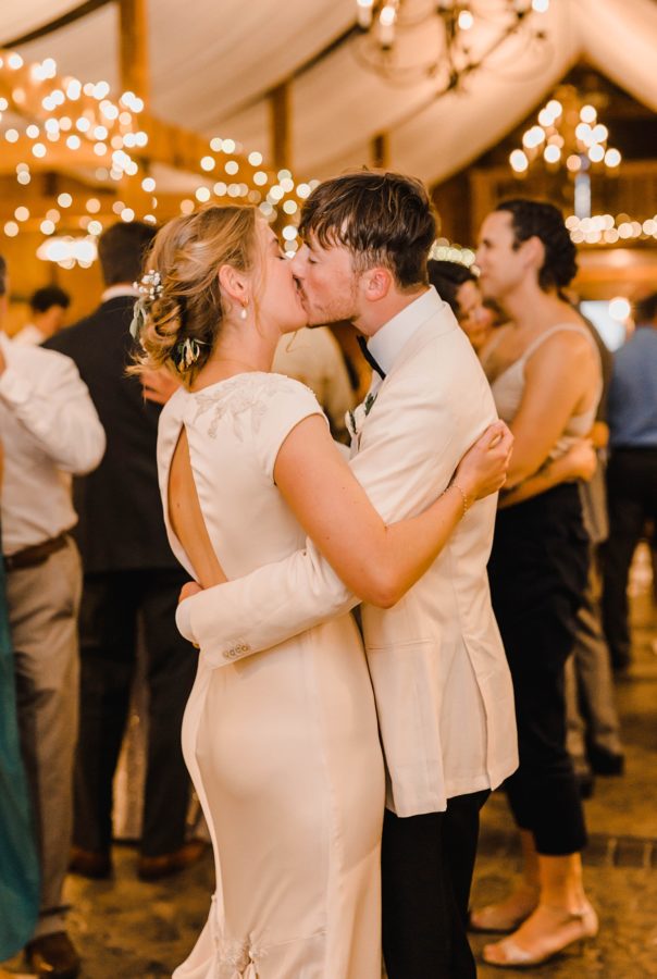 intimate bluemont vineyard wedding bride and groom kissing