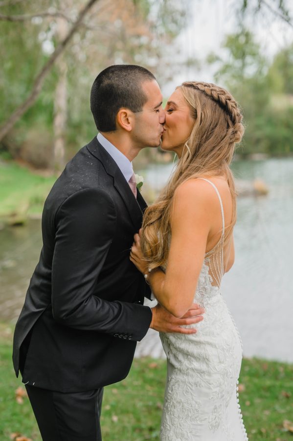bride and groom kissing portrait fall wedding