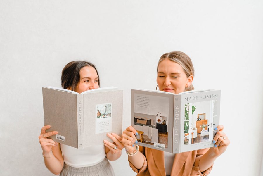 girls laughing holding books neutrals