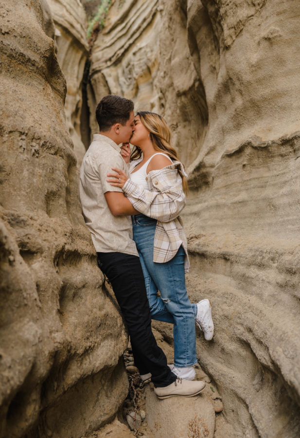 calafia beach engagement couple kissing neutrals