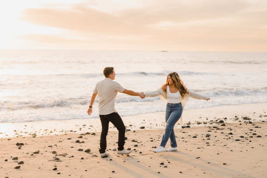 couple dancing holding hands calafia beach golden hour