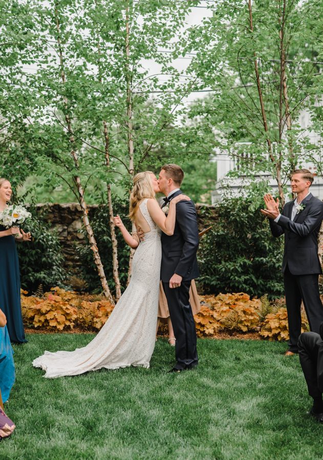 middleburg garden wedding bride and groom kiss wedding party